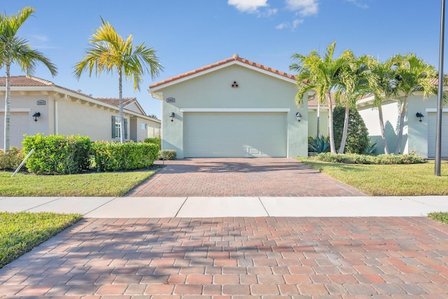 mediterranean / spanish home with a front yard