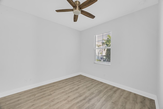 spare room featuring light hardwood / wood-style flooring and ceiling fan