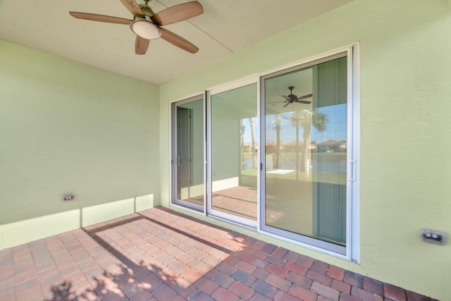 view of patio featuring ceiling fan