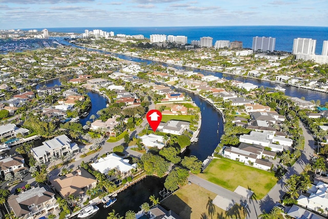 bird's eye view with a water view and a residential view