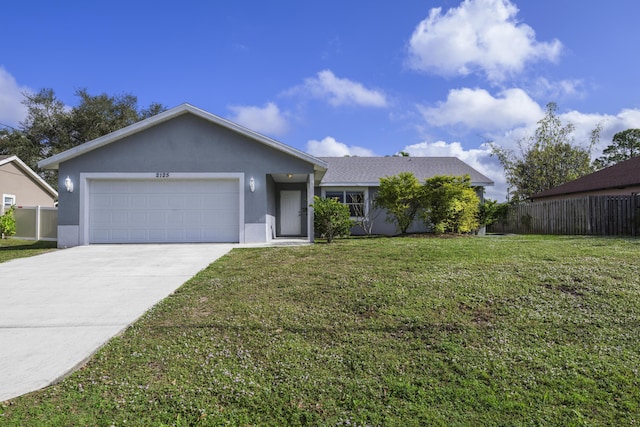 ranch-style house featuring a front yard and a garage