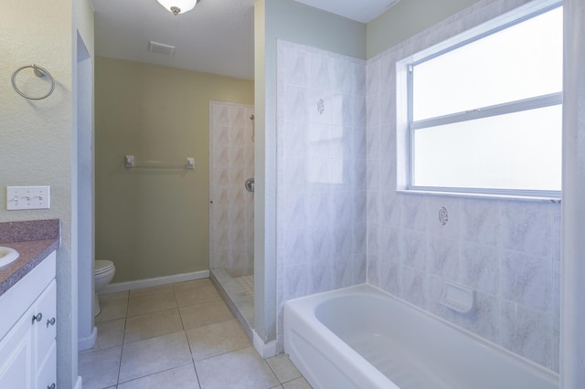 full bathroom featuring tile patterned floors, vanity, a healthy amount of sunlight, and toilet