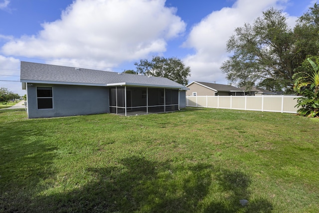 view of yard with a sunroom