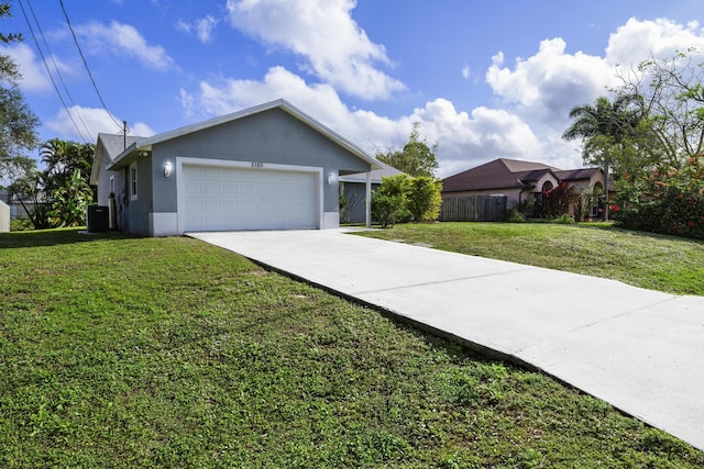 view of front facade featuring a front yard, a garage, and cooling unit