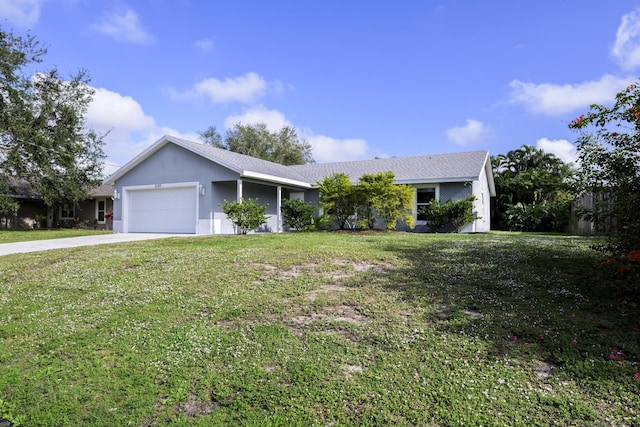 ranch-style home featuring a garage and a front lawn