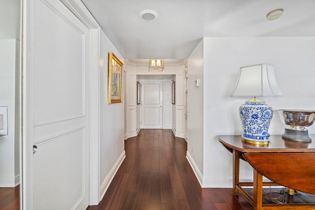 corridor with dark wood-type flooring