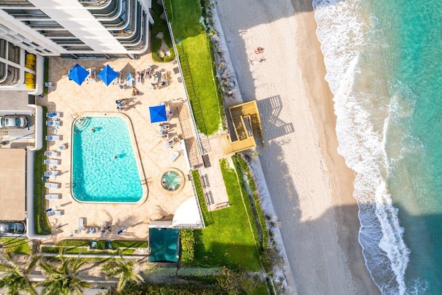 bird's eye view with a beach view and a water view