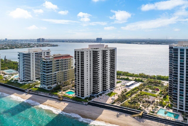 birds eye view of property featuring a view of the beach and a water view