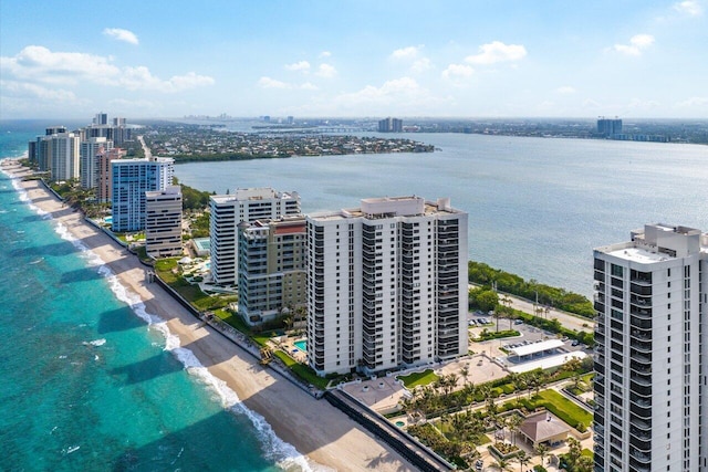 birds eye view of property featuring a water view and a view of the beach