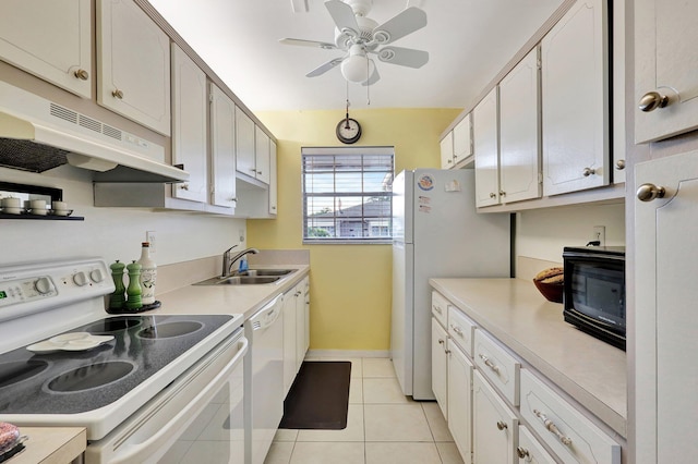 kitchen featuring white cabinetry, sink, ceiling fan, white appliances, and light tile patterned flooring