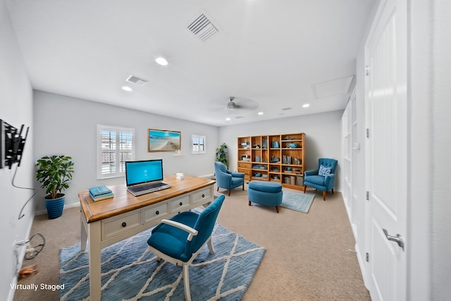 carpeted office with ceiling fan