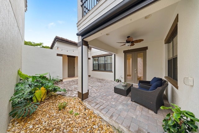 view of patio / terrace with ceiling fan, an outdoor hangout area, and french doors