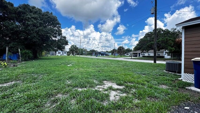 view of yard with central AC unit