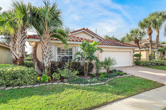 mediterranean / spanish-style house with a front lawn and a garage