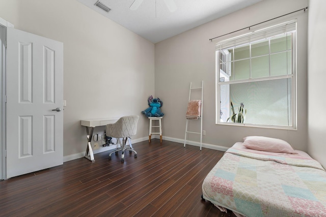 bedroom featuring ceiling fan and dark hardwood / wood-style floors