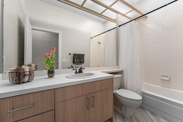 full bathroom with wood-type flooring, vanity, toilet, and shower / bathtub combination with curtain