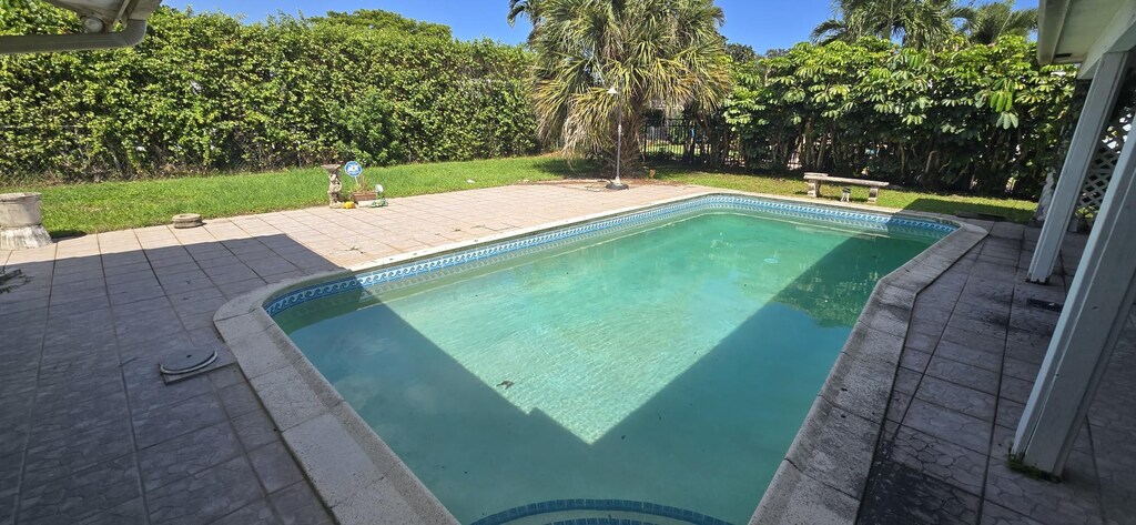 view of swimming pool with a patio area