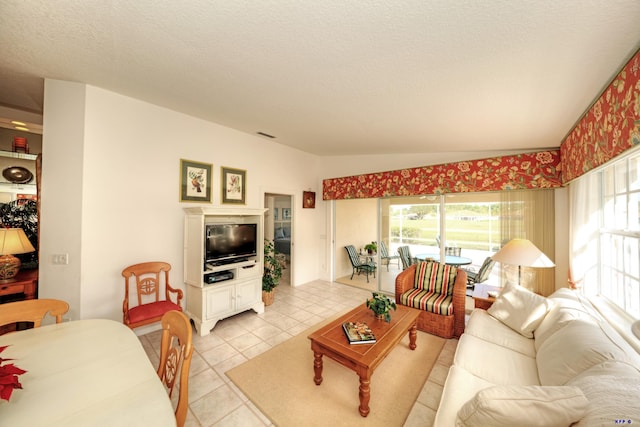 tiled living room featuring a textured ceiling and vaulted ceiling