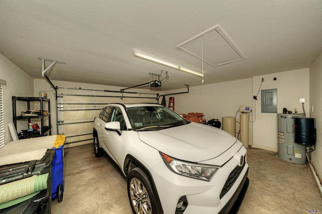 garage featuring electric panel, electric water heater, and a garage door opener