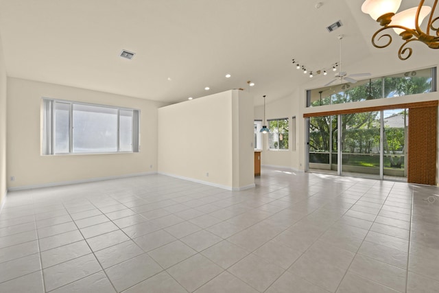 empty room with visible vents, baseboards, ceiling fan, high vaulted ceiling, and light tile patterned flooring