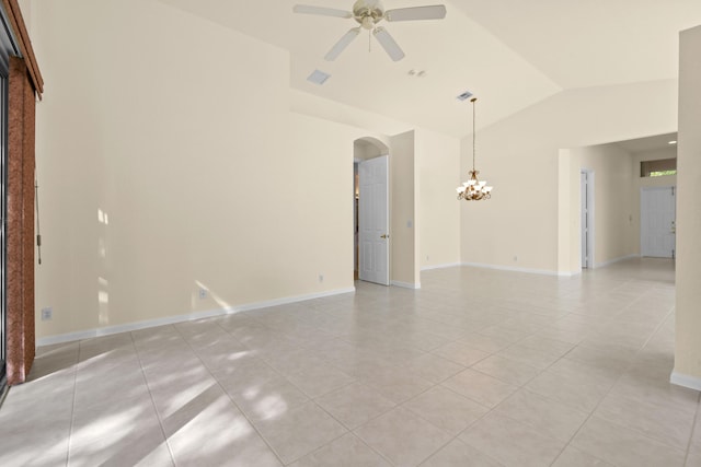 unfurnished room with visible vents, arched walkways, lofted ceiling, ceiling fan with notable chandelier, and light tile patterned flooring