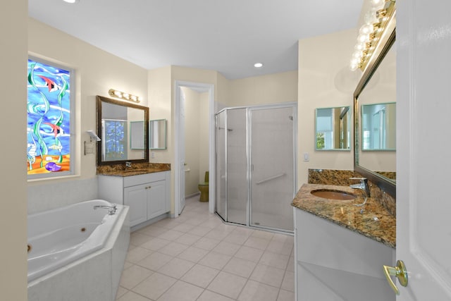 full bathroom with tile patterned floors, toilet, vanity, and shower with separate bathtub