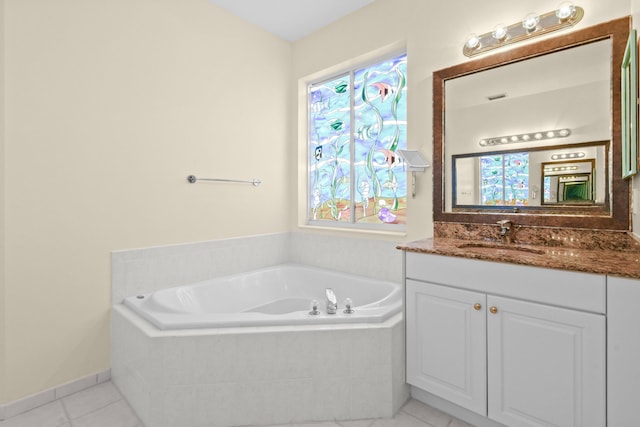 bathroom with visible vents, tile patterned flooring, vanity, and a bath