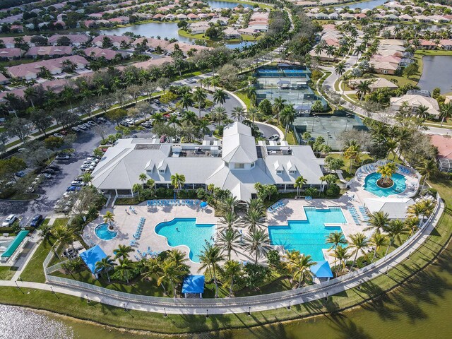 bird's eye view with a water view and a residential view