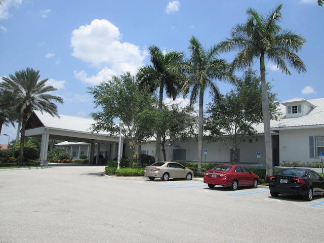 view of property featuring uncovered parking