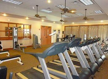 exercise room with a raised ceiling