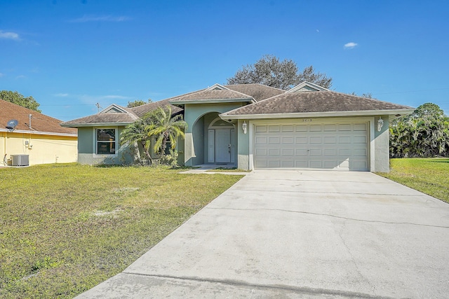 ranch-style home featuring a front yard, central AC, and a garage