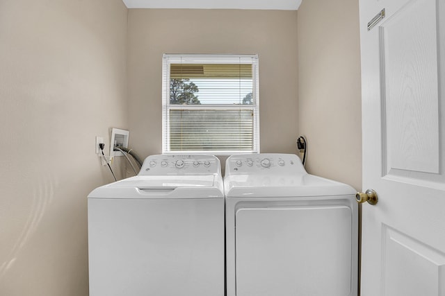 laundry room featuring separate washer and dryer