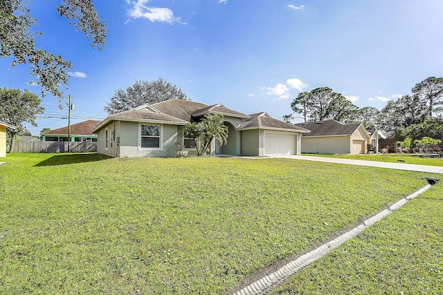 ranch-style house featuring a garage and a front lawn