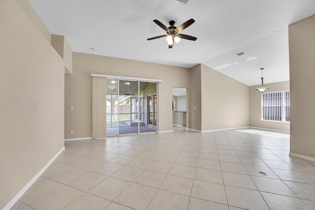 tiled empty room featuring ceiling fan