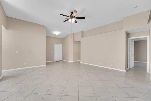 spare room featuring ceiling fan and light tile patterned flooring