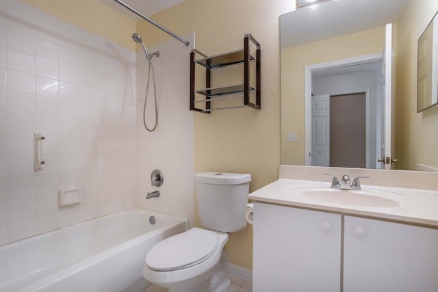 full bathroom featuring tile patterned flooring, vanity, toilet, and tiled shower / bath