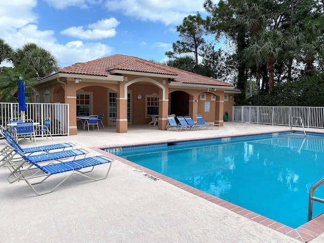 view of swimming pool featuring a patio area