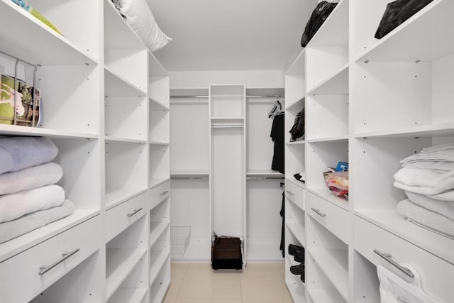 spacious closet with light tile patterned flooring