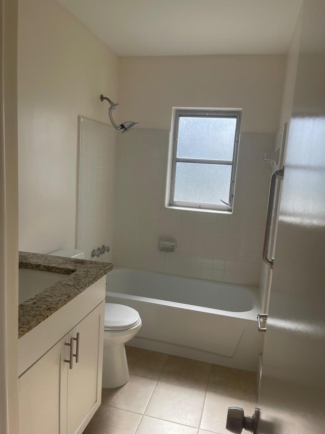 full bathroom with tile patterned flooring, vanity, toilet, and tiled shower / bath