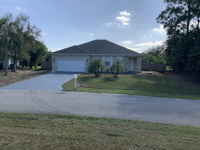 single story home with a garage and a front lawn