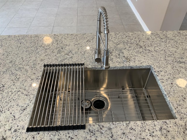 room details with stone counters and a sink