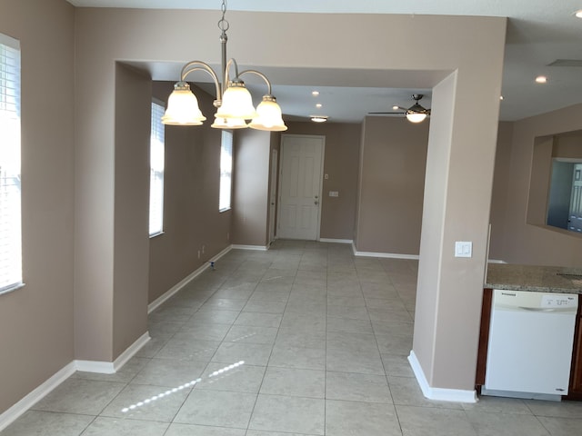 unfurnished dining area with light tile patterned floors, baseboards, and recessed lighting