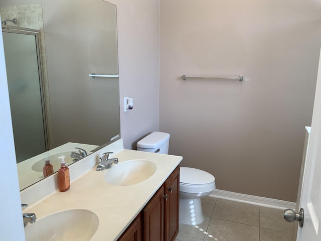 full bath with tile patterned flooring, a sink, and toilet