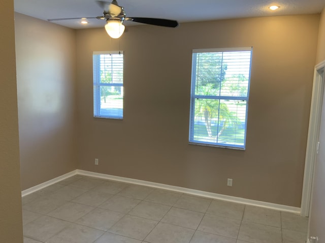 empty room featuring ceiling fan, recessed lighting, and baseboards