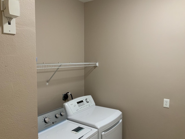 laundry area featuring laundry area and washing machine and clothes dryer