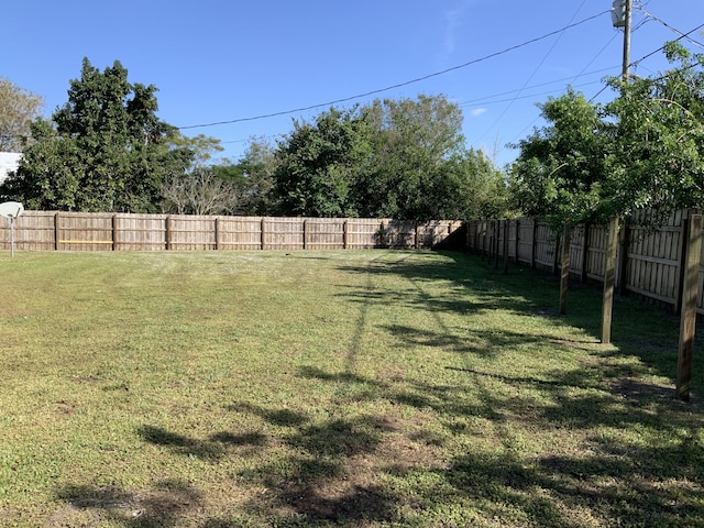 view of yard with a fenced backyard