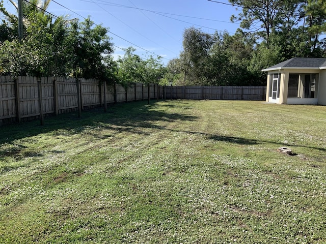 view of yard featuring a fenced backyard