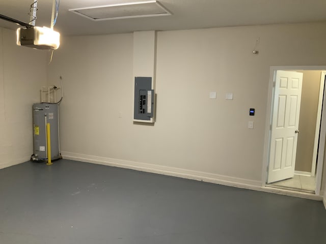 garage with baseboards, a garage door opener, electric water heater, and electric panel