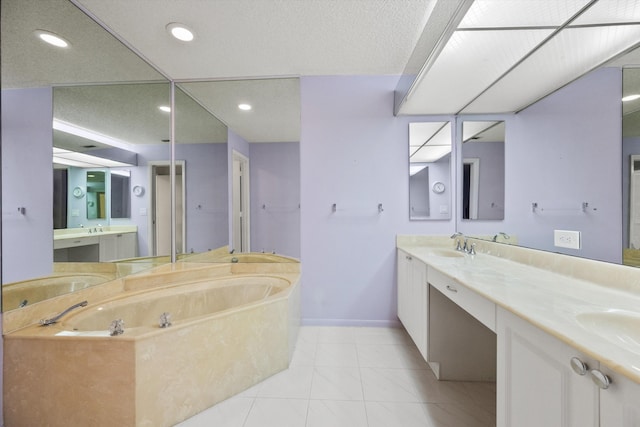 bathroom with tile patterned floors, vanity, and a tub