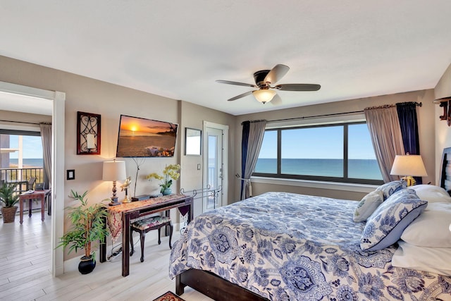 bedroom with light hardwood / wood-style floors and ceiling fan